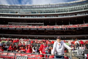 Father/son Nebraska Cornhusker fans watching warm-ups during a college football game against the Ohio State Buckeyes Saturday, October 26, 2024, in Columbus, Ohio. Photo by John S. Peterson.