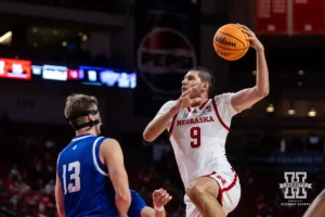 Nebraska Cornhusker Berke Büyüktuncel (9) goes for a layup against Grand Valley State Laker Ethan Alderink (13) in the first half during a college men’s basketball game Thursday, October 27, 2024, in Lincoln, Nebraska. Photo by John S. Peterson.