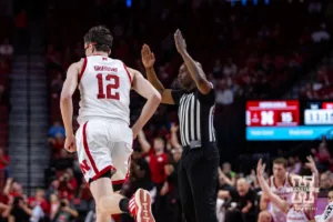 Nebraska Cornhusker Gavin Griffiths (12) runs back down court after making a three-point shot against the Grand Valley State Lakers in the first half during a college men’s basketball game Thursday, October 27, 2024, in Lincoln, Nebraska. Photo by John S. Peterson.