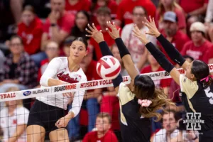 Nebraska Cornhusker Merritt Beason (13) spikes the ball against the Purdue Boilermakers during a college volleyball match Friday, October 11, 2024, in Lincoln, Nebraska. Photo by John S. Peterson.