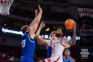 Nebraska Cornhusker Brice Williams (3) makes a lay up against Grand Valley State Laker Ethan Alderink (13) in the first half during a college men’s basketball game Thursday, October 27, 2024, in Lincoln, Nebraska. Photo by John S. Peterson.