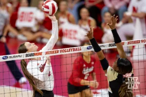 Nebraska Cornhusker Bergen Reilly (2) tips the ball against the Purdue Boilermakers during a college volleyball match Friday, October 11, 2024, in Lincoln, Nebraska. Photo by John S. Peterson.