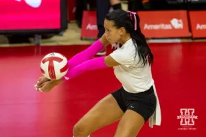 Nebraska Cornhusker Harper Murray (27) digs the ball against the Rutgers Scarlet Knights during a college volleyball match Saturday, October 12, 2024, in Lincoln, Nebraska. Photo by John S. Peterson.