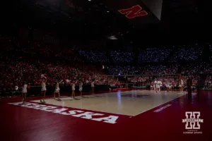 Between the second and third set the cheer squad lead Husker Power with a light show during a college volleyball match Friday, October 11, 2024, in Lincoln, Nebraska. Photo by John S. Peterson.