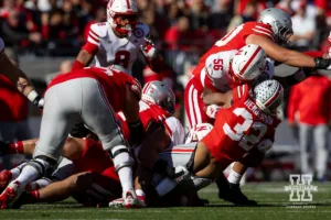 Nebraska Cornhusker defensive lineman Ty Robinson (9) tackles Ohio State Buckeye running back TreVeyon Henderson (32) during a college football game Saturday, October 26, 2024, in Columbus, Ohio. Photo by John S. Peterson.