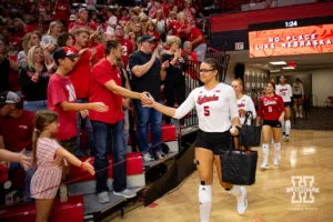 Nebraska Cornhusker Rebekah Allick (5) leads the them out for the third set against the Purdue Boilermakers during a college volleyball match Friday, October 11, 2024, in Lincoln, Nebraska. Photo by John S. Peterson.