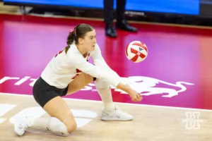 Nebraska Cornhusker Lindsay Krause (22) digs the ball against the Purdue Boilermakers during a college volleyball match Friday, October 11, 2024, in Lincoln, Nebraska. Photo by John S. Peterson.