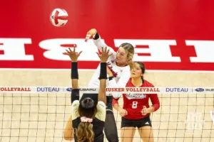 Nebraska Cornhusker Andi Jackson (15) spikes the ball against the Purdue Boilermakers during a college volleyball match Friday, October 11, 2024, in Lincoln, Nebraska. Photo by John S. Peterson.