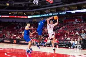 Nebraska Cornhusker Braden Frager (5) is fouled by Grand Valley State Laker Trevor Smith Jr. (5) in the second half during a college men’s basketball game Thursday, October 27, 2024, in Lincoln, Nebraska. Photo by John S. Peterson.