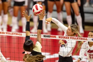 Nebraska Cornhusker Andi Jackson (15) spikes the ball against the Purdue Boilermakers during a college volleyball match Friday, October 11, 2024, in Lincoln, Nebraska. Photo by John S. Peterson.