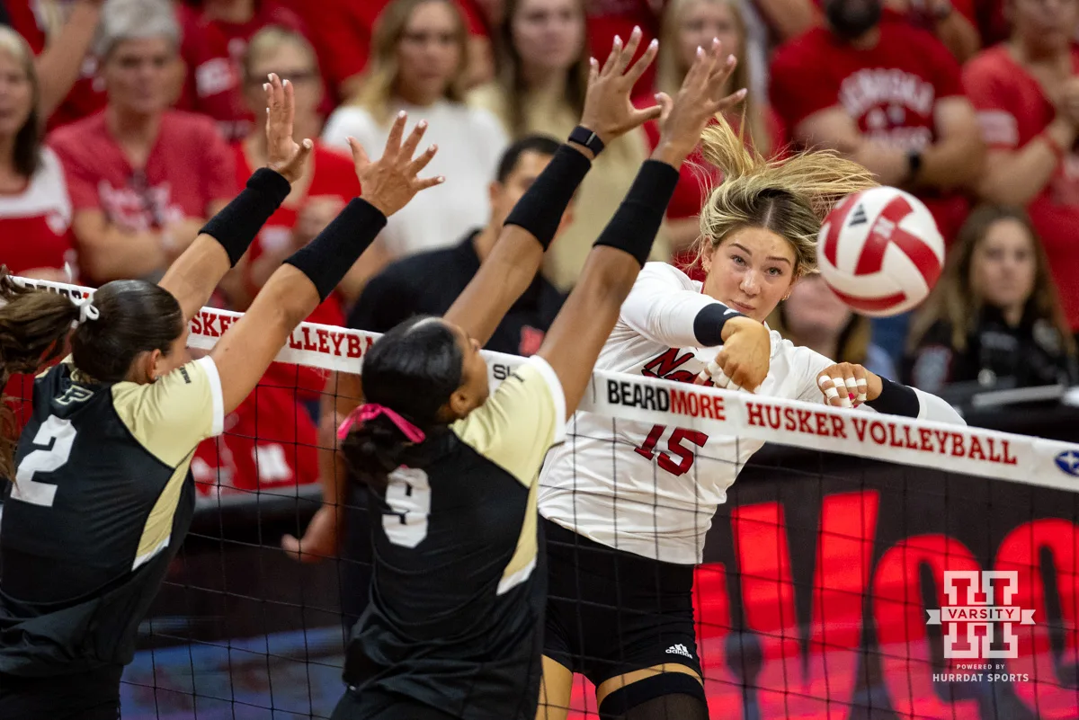 Nebraska Cornhusker Andi Jackson (15) spikes the ball against the Purdue Boilermakers during a college volleyball match Friday, October 11, 2024, in Lincoln, Nebraska. Photo by John S. Peterson.