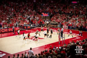 Nebraska Cornhusker Merritt Beason (13) spikes ball for Match point against the Purdue Boilermakers during a college volleyball match Friday, October 11, 2024, in Lincoln, Nebraska. Photo by John S. Peterson.