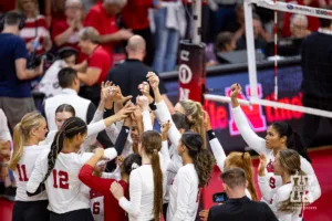 Nebraska Cornhuskers huddle up after the win against the Purdue Boilermakers during a college volleyball match Friday, October 11, 2024, in Lincoln, Nebraska. Photo by John S. Peterson.