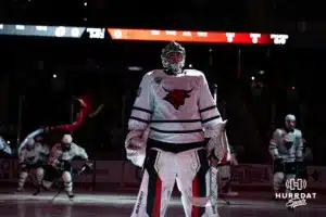 Omaha Maverick Simon Latkoczy (30) lines up during Omaha Hockey introductions before taking on the Wisconsin Badgers in a college hockey match Saturday, October 5, 2024 in Omaha, Nebraska. Photo by Kyle Byers.