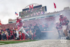 Nebraska Cornhusker quarterback Dylan Raiola (15) leads the Huskers out to the field against the UCLA Bruins during a college football game Saturday, November 2, 2024, in Lincoln, Nebraska. Photo by John S. Peterson.