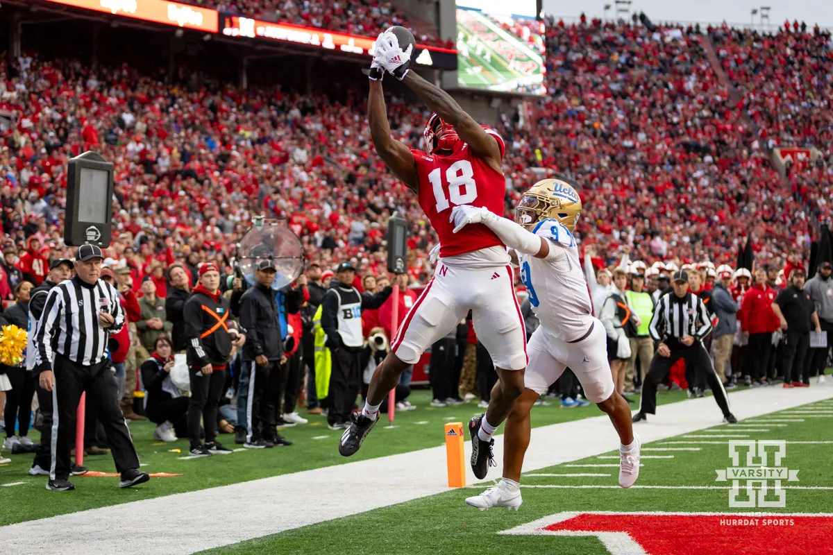 Nebraska Cornhusker wide receiver Isaiah Neyor (18) makes a catch for a touchdown against UCLA Bruin defensive back Kaylin Moore (9) in the third quarter during a college football game Saturday, November 2, 2024, in Lincoln, Nebraska. Photo by John S. Peterson.