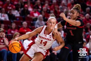 Nebraska Cornhusker guard Callin Hake (14) drives to the basket against Rutgers Scarlet Knight guard Lauryn Swann (1) in the first quarter during a women’s basketball game on Saturday, Feb. 28, 2026, in Lincoln, Nebraska. Photo by John S. Peterson.