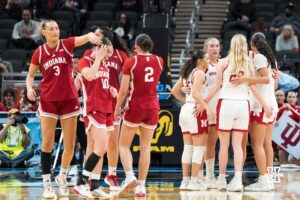 Nebraska Cornhuskers huddle during a college basketball game against Indiana on Mar 4th, 2026, in Indianapolis, Indiana. Photo by Brandon Tiedemann